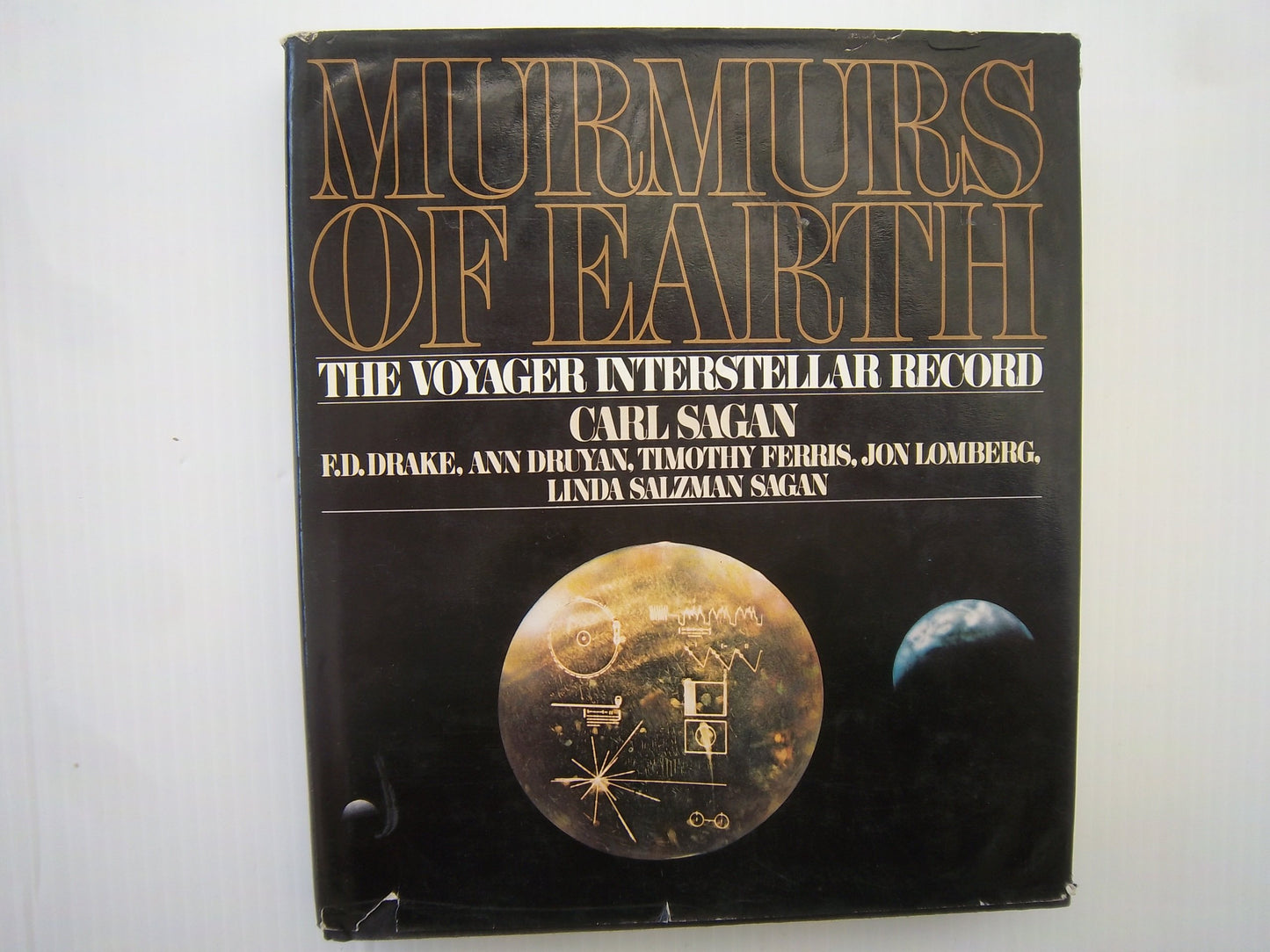 Murmurs of Earth: The Voyager Interstellar Record