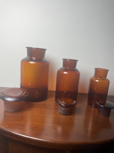 Three Vintage Amber Glass Apothecary Jars With Glass Stoppers