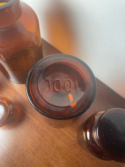 Three Vintage Amber Glass Apothecary Jars With Glass Stoppers