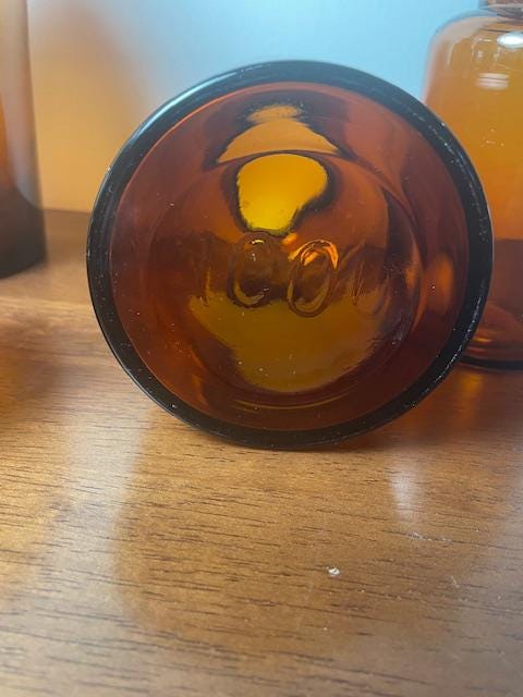 Three Vintage Amber Glass Apothecary Jars With Glass Stoppers